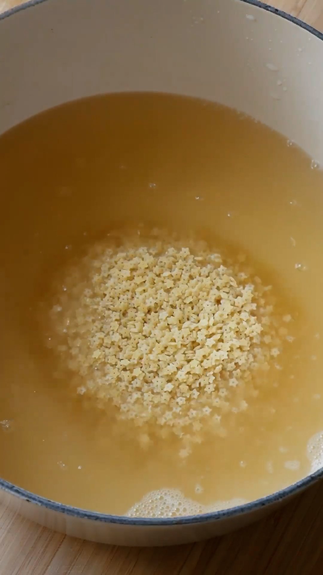 Uncooked pastina in chicken broth