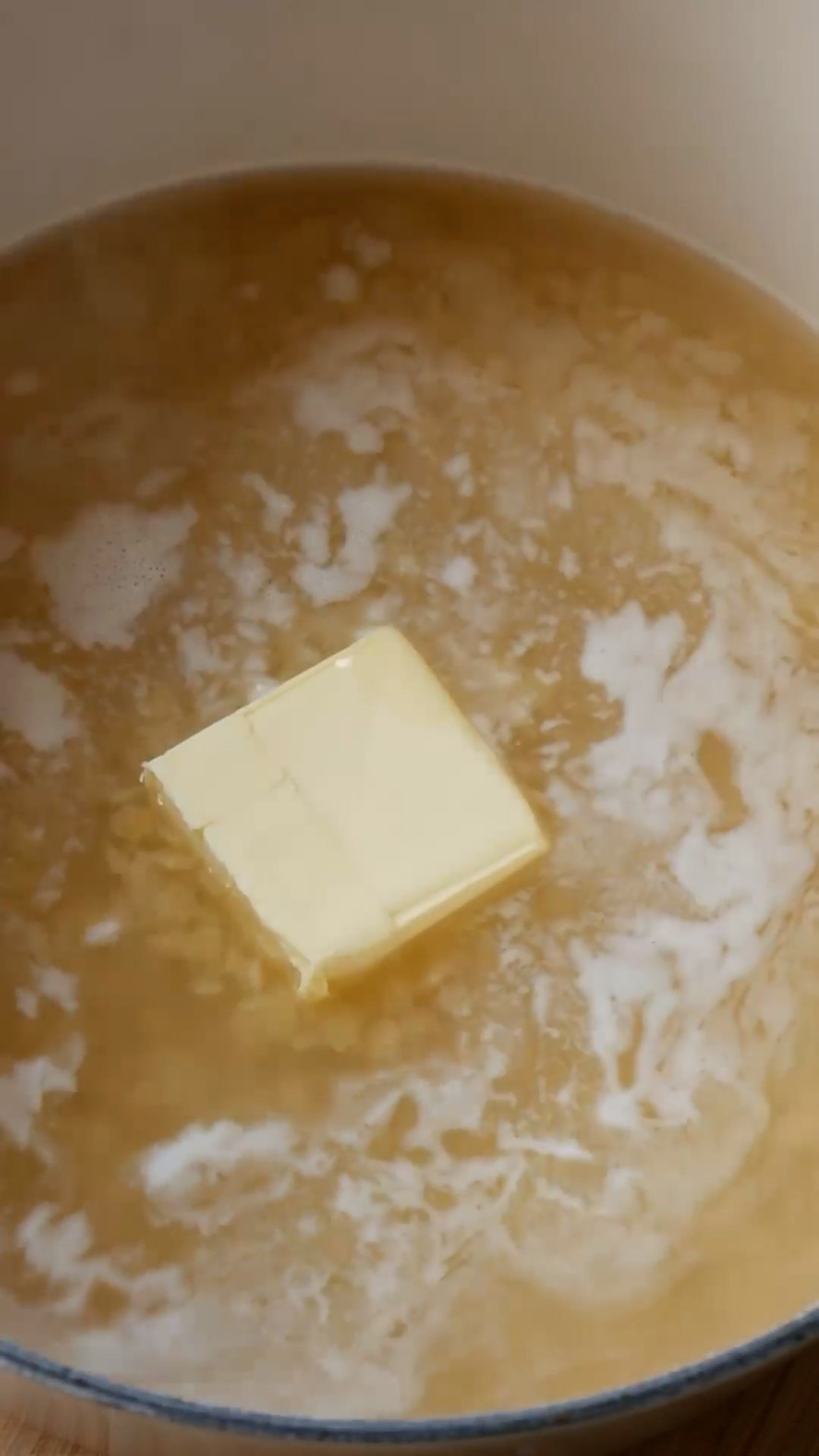 Butter added to pot with pastina and chicken broth