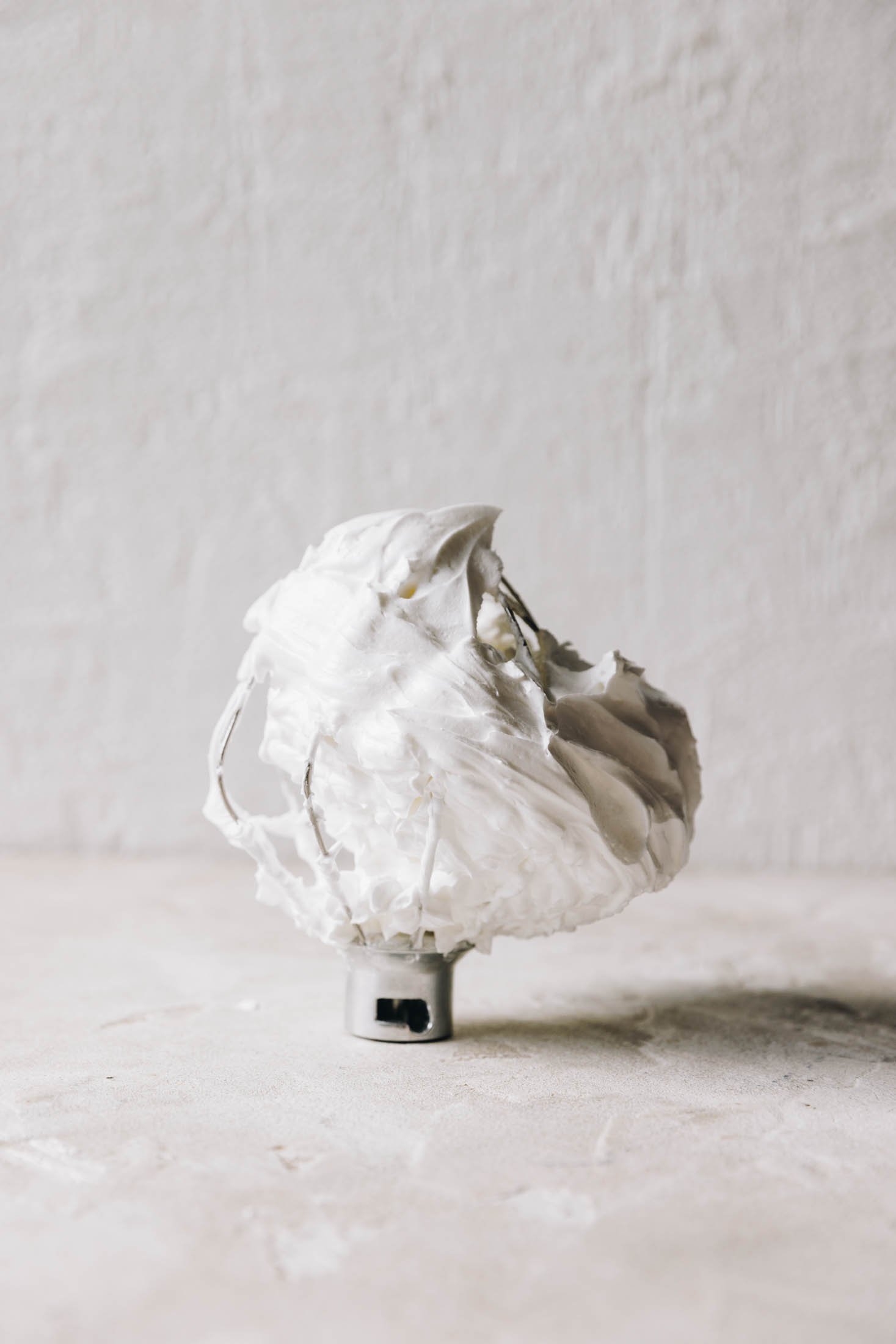 You can see the attachement from a stand mixer with the meringue on it.