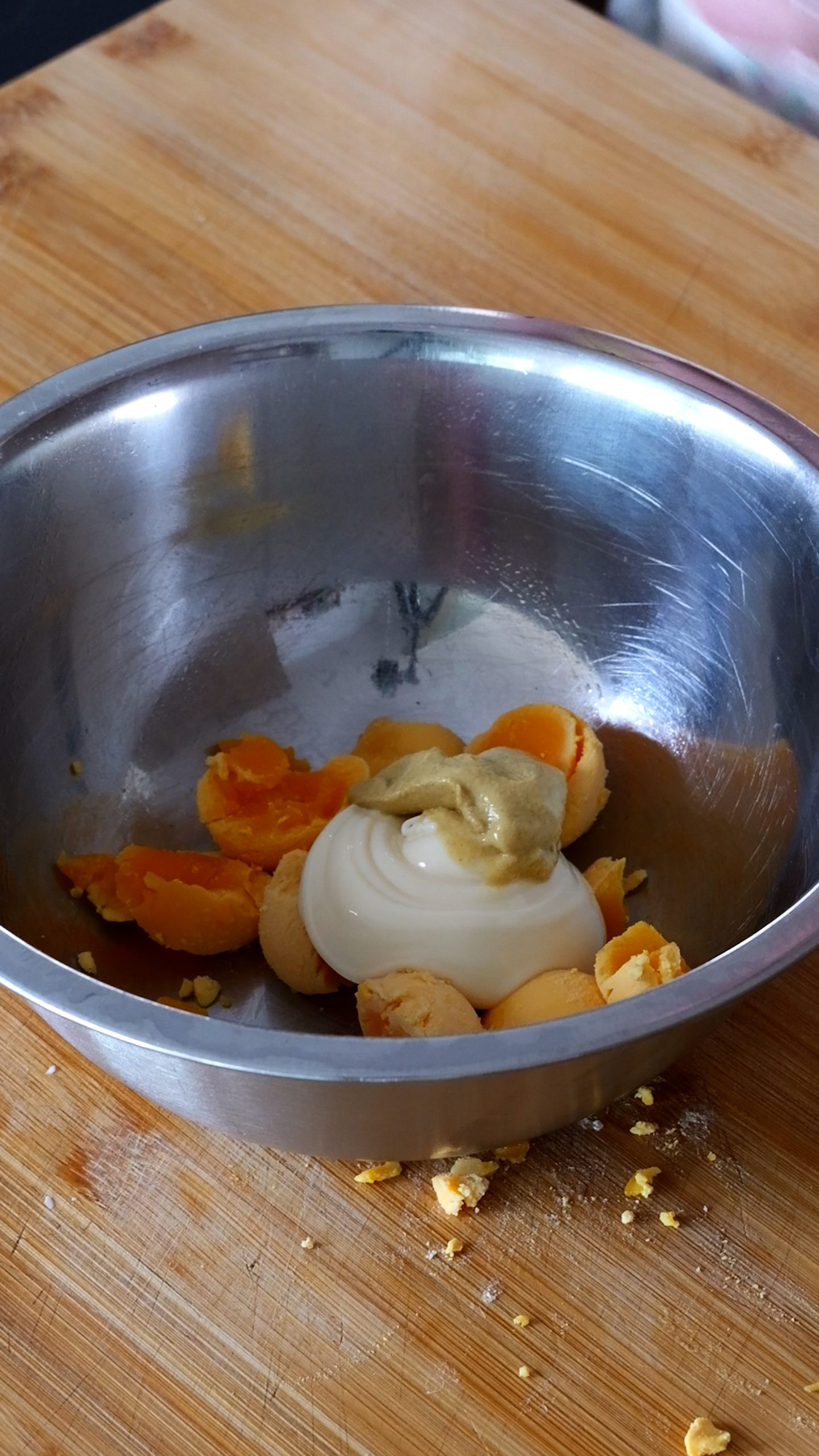 egg yolks and mayo in small bowl