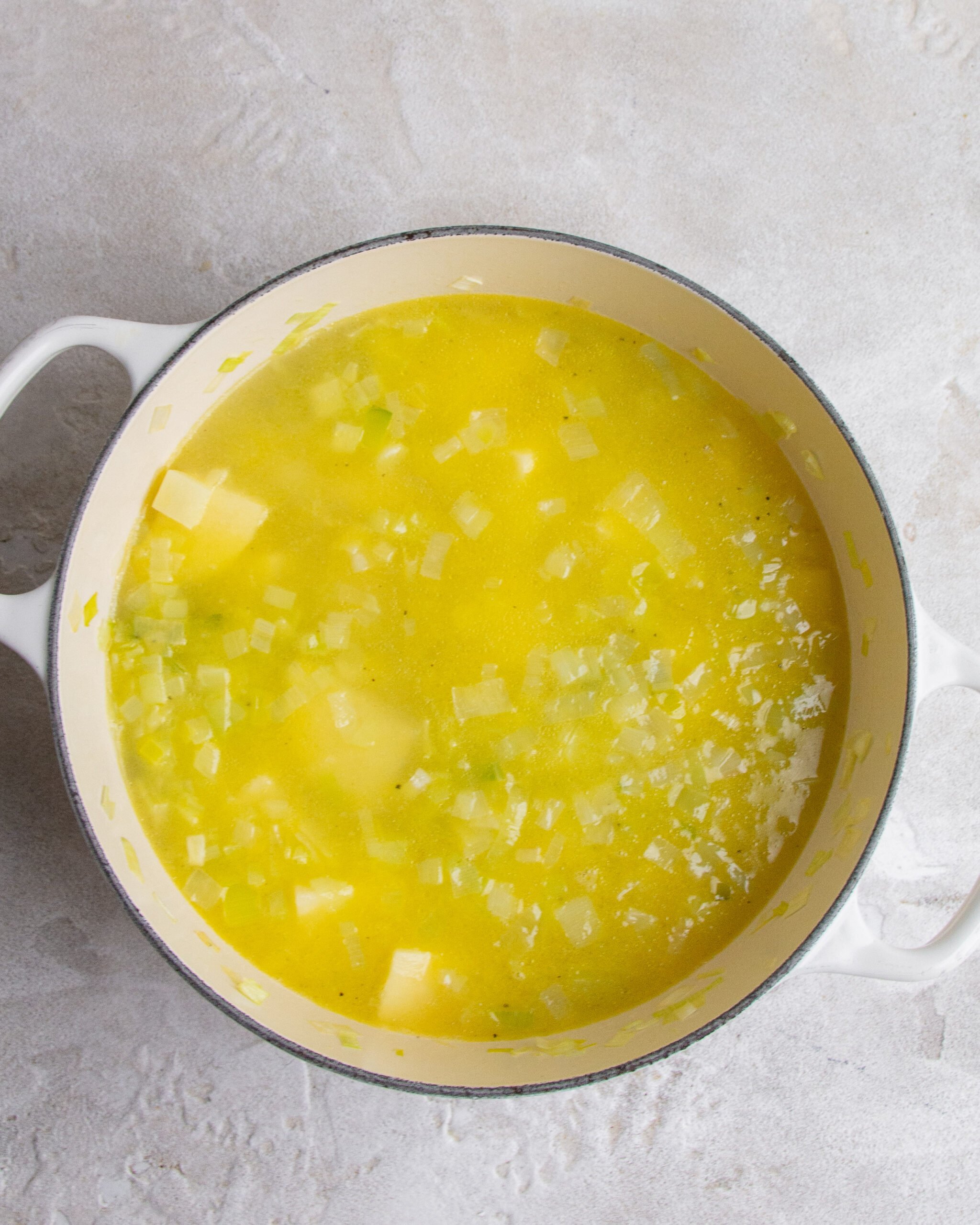 Soup is in white bowl and has not been blended. 