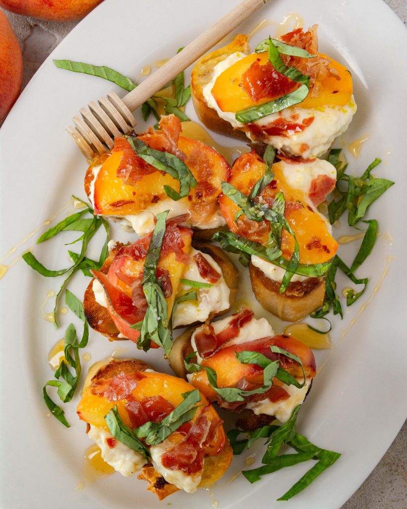 Peach and crispy prosciutto crostini