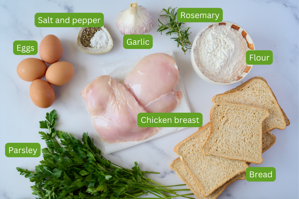 Image of all the ingredients needed for this crispy breaded chicken recipe. Image includes eggs, garlic, salt and pepper, flour, chicken breast, parsley and bread. 