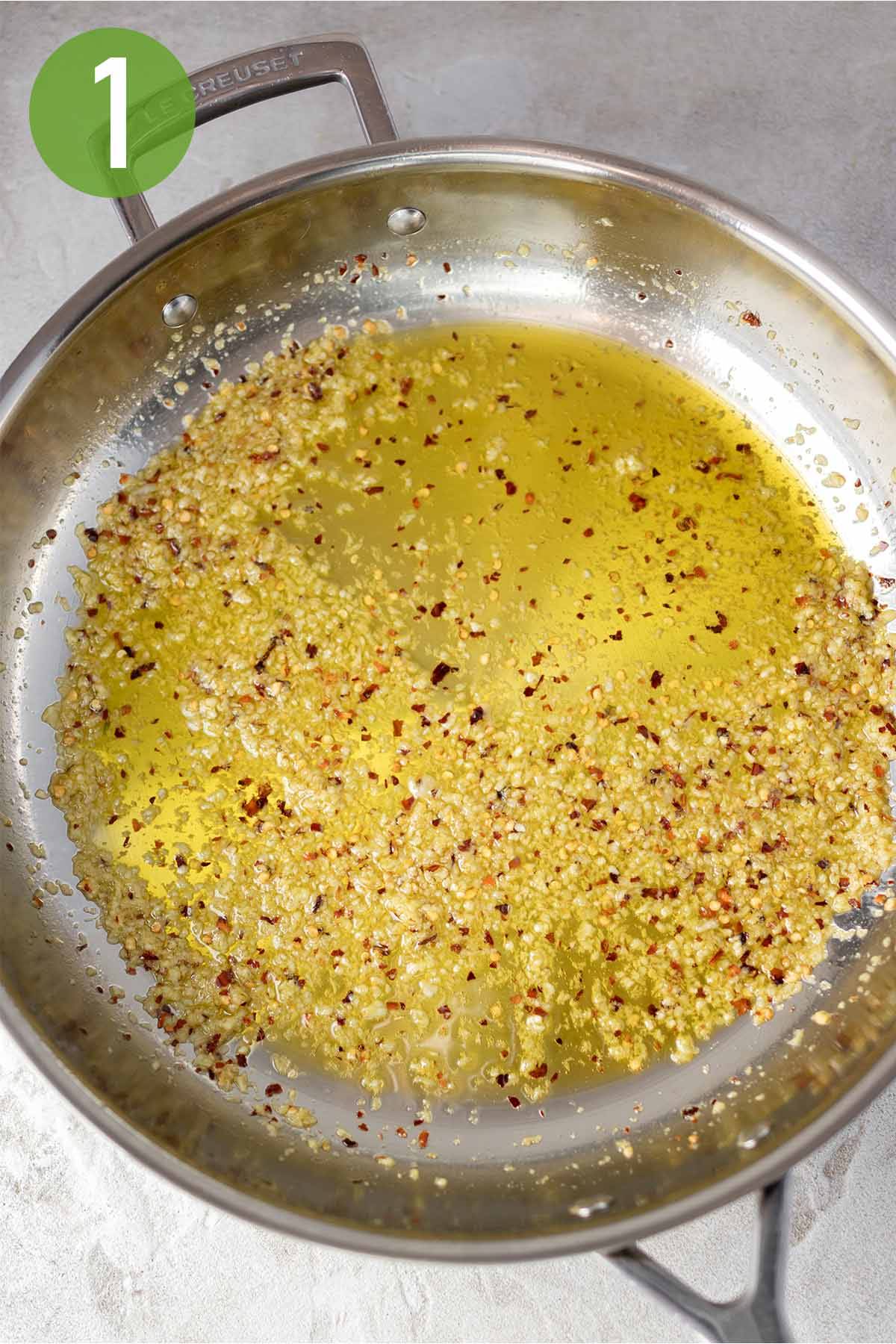 cooking garlic and red pepper flakes in hot olive oil.