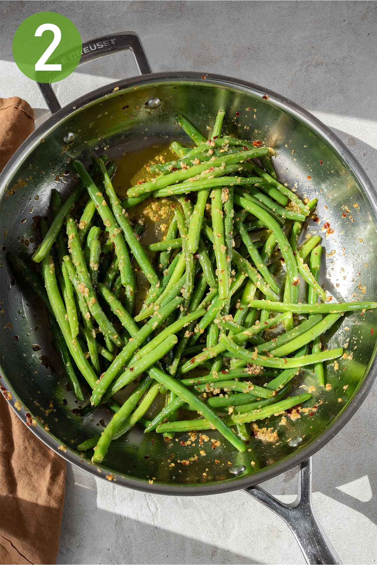 cooked green beans in a large skillet.
