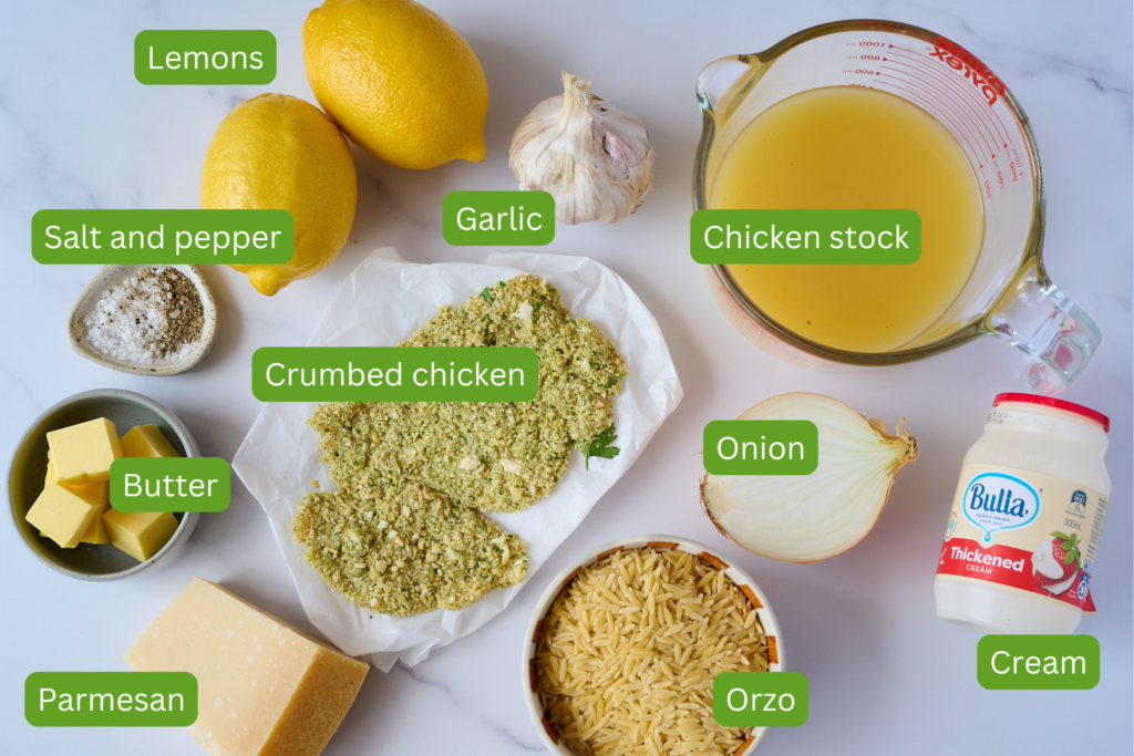 Image of all ingredients with labels needed for this recipe. Ingredients include lemons, garlic, chicken stock, salt and pepper, onion, cream, orzo, parmesan, butter, crumbed chicken