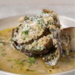 breadcrumb stuffed artichoke with olive oil.