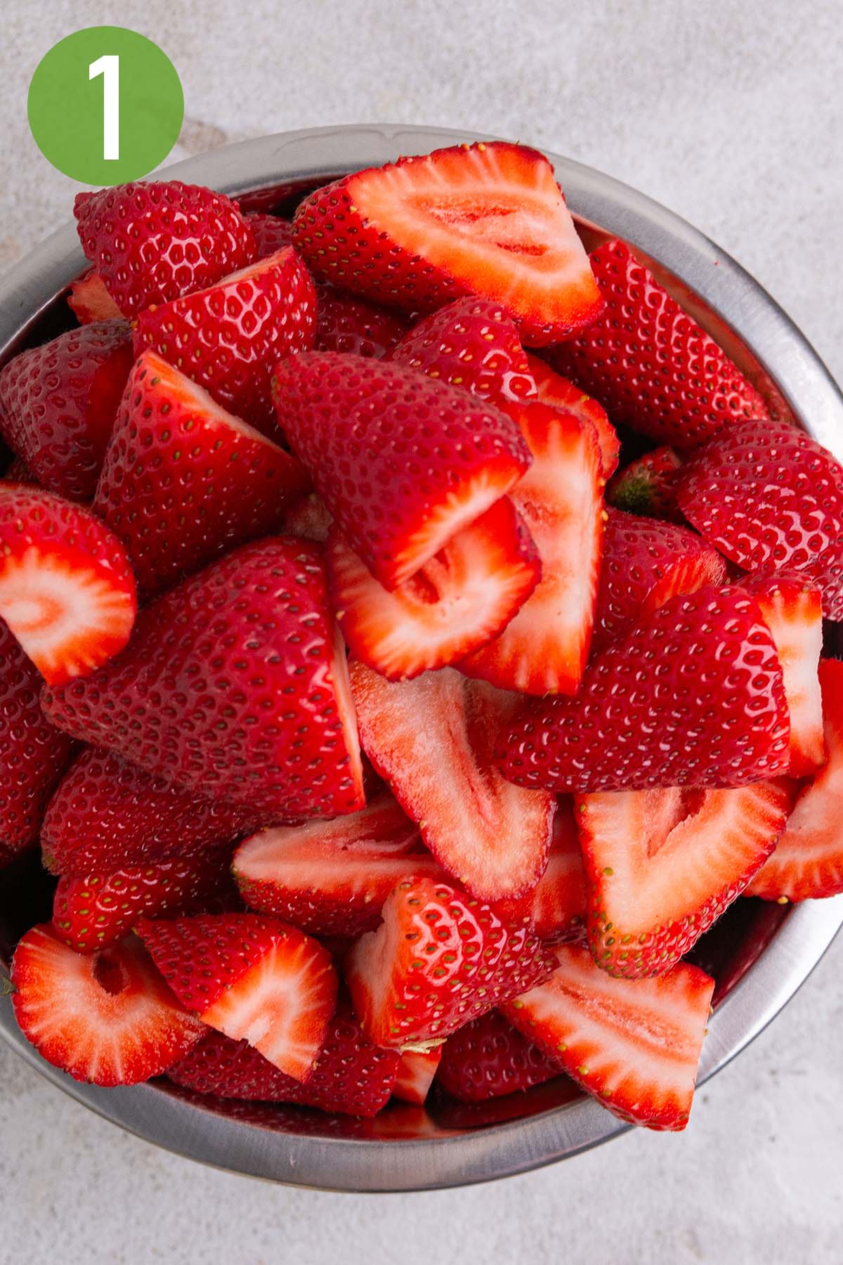 sliced strawberries in a mixing bowl.