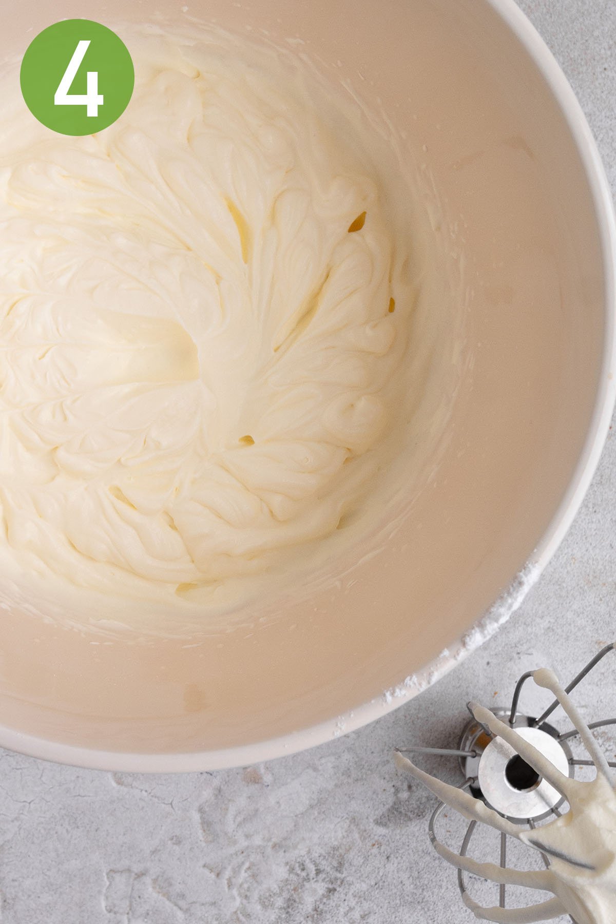 whipping the cream in a large mixing bowl.