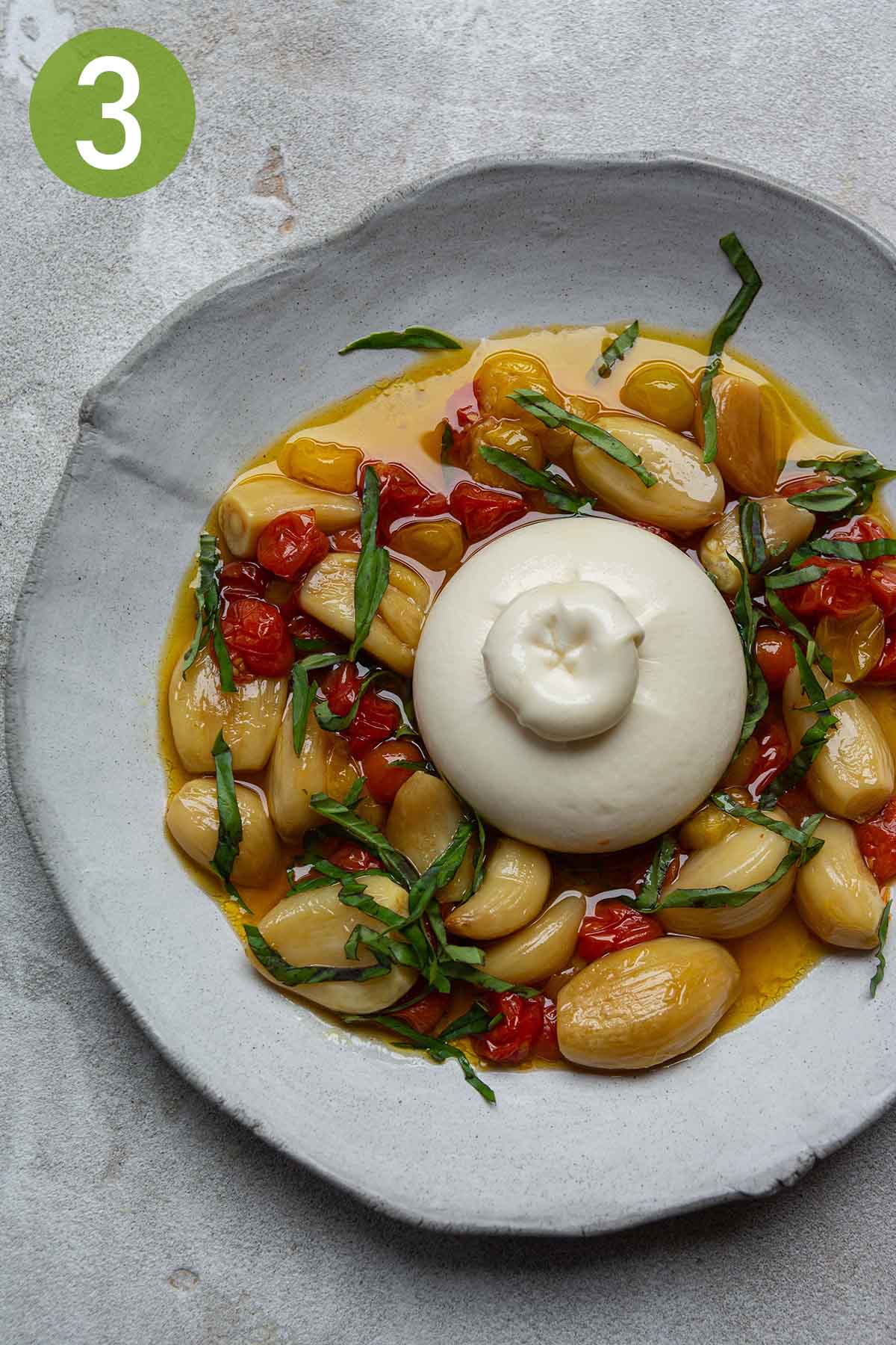 baked tomato and garlic confit with burrata.