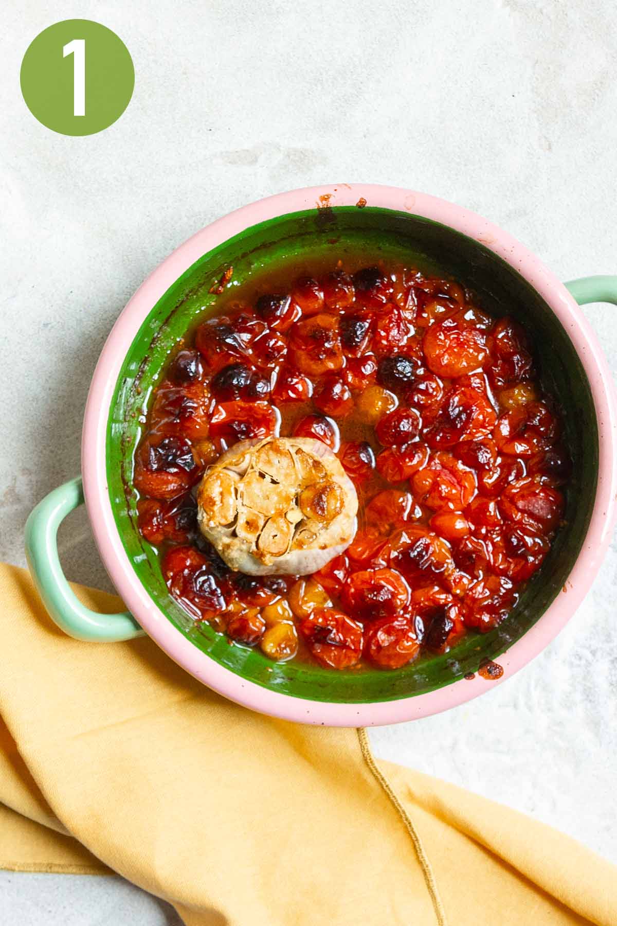 roasted garlic and tomatoes in a small dish.