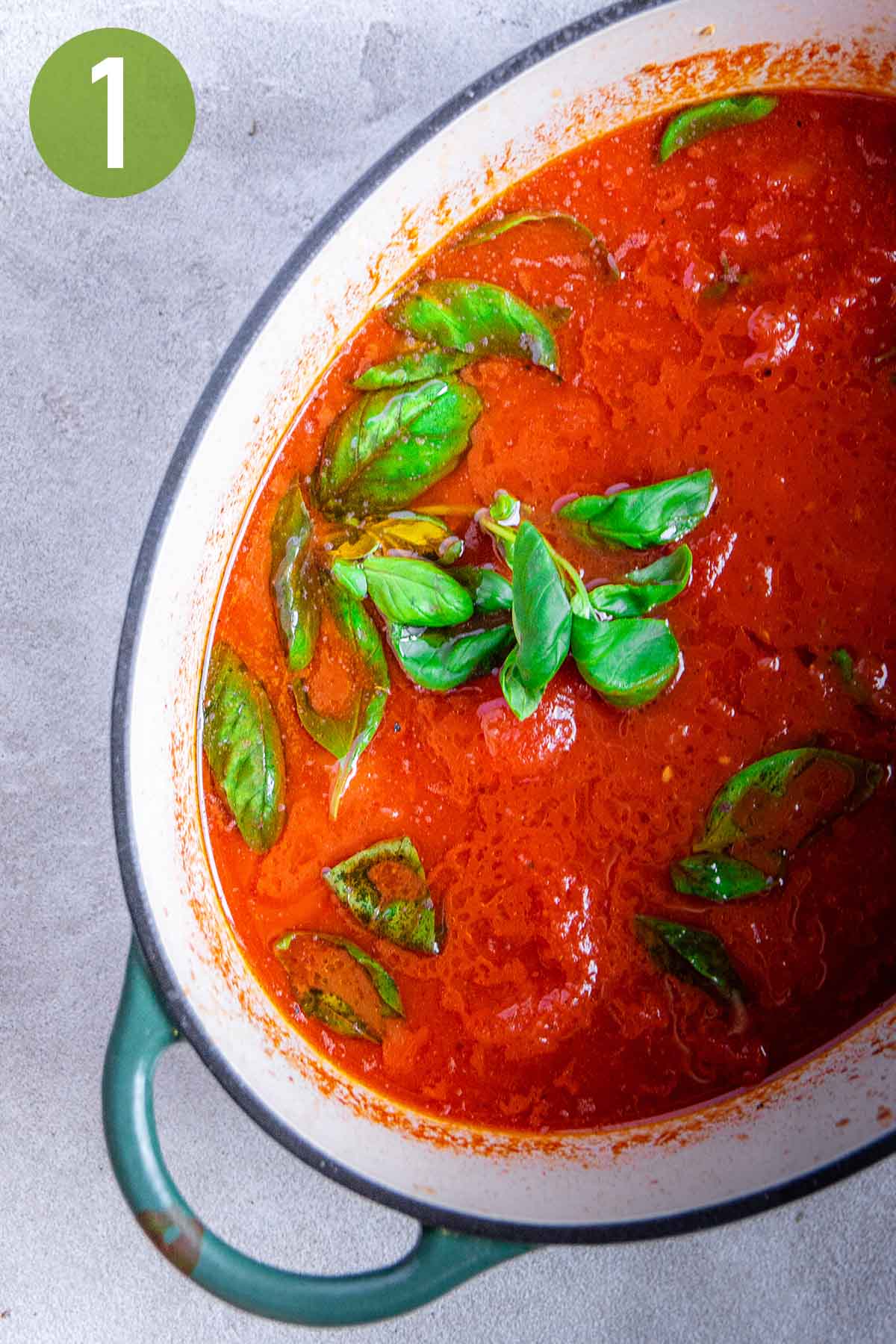 tomato and basil sauce in an oval pot.