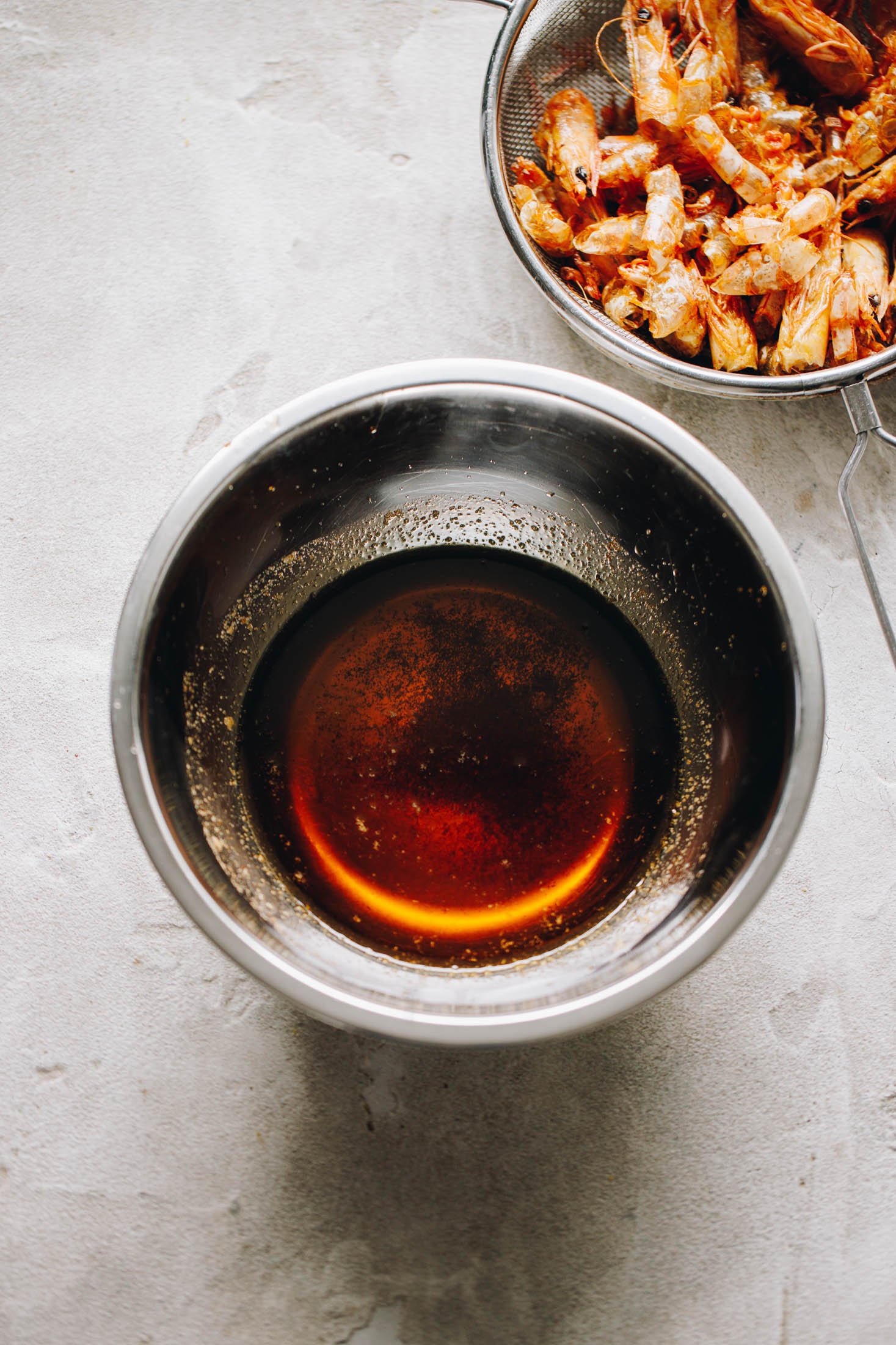 Orange oil in stainless steel bowl