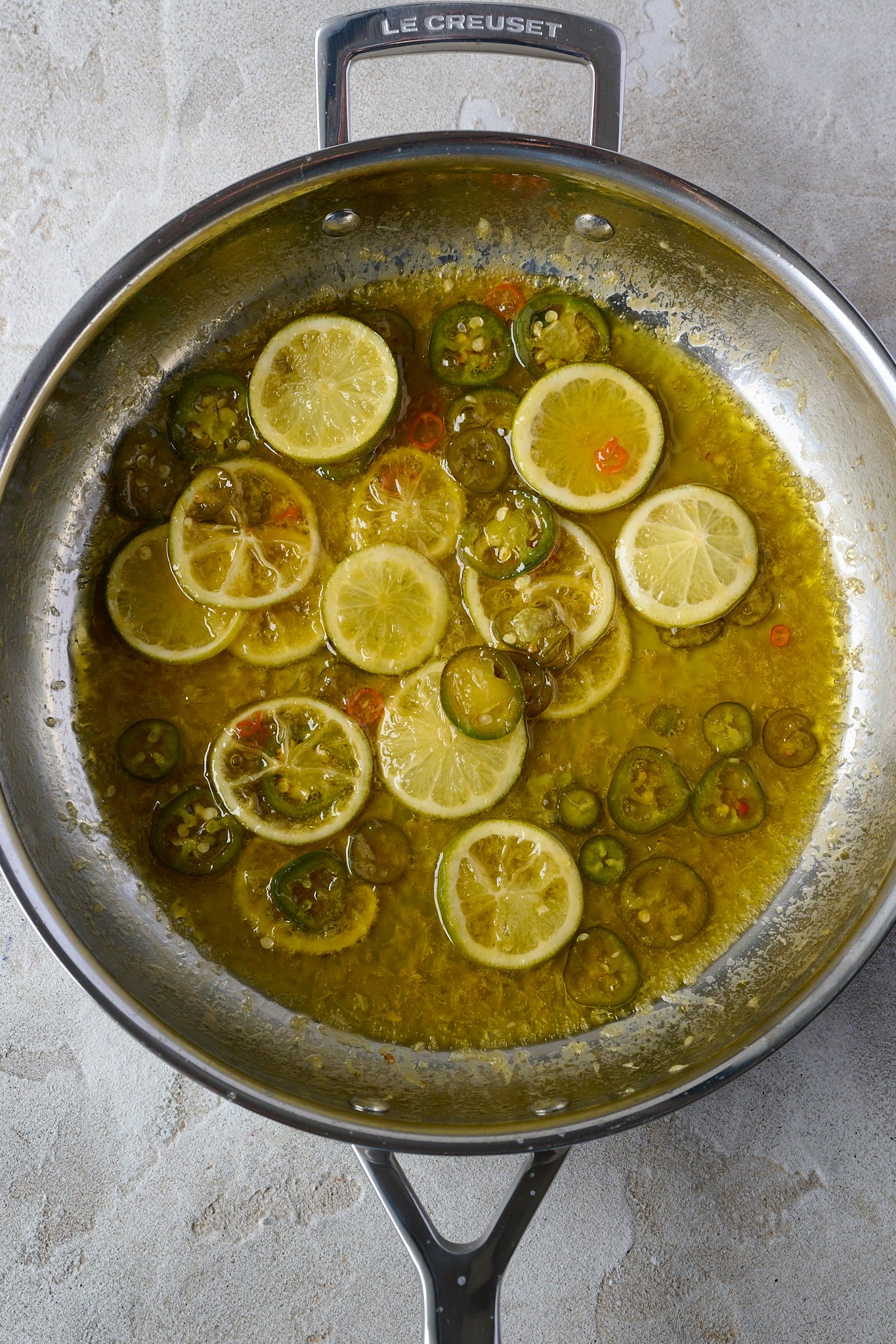 Cooked limes and jalepeno in large stainless steel pan with lots of butter. 