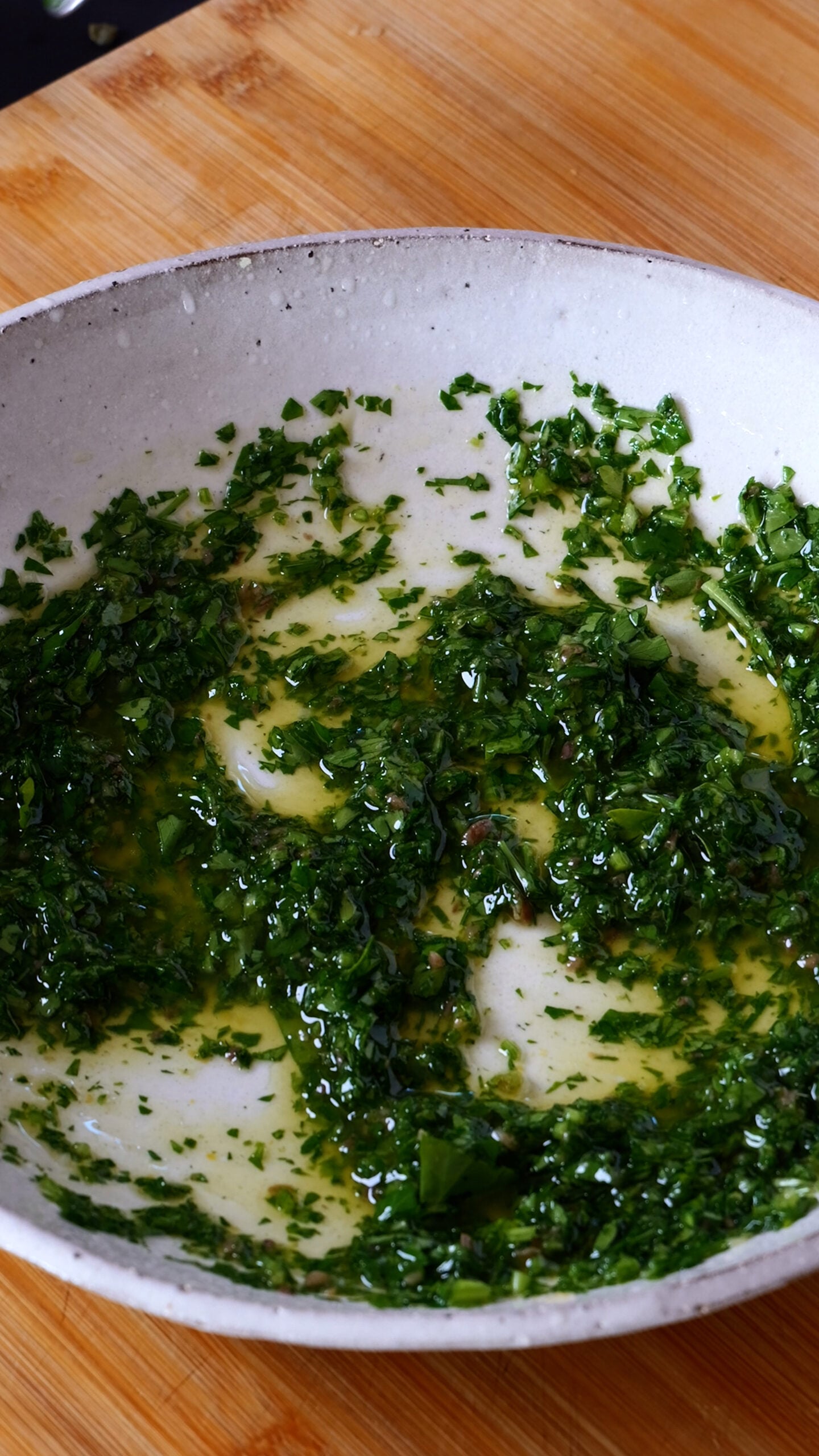 Dressing for Italian Potato Salad in large white bowl.